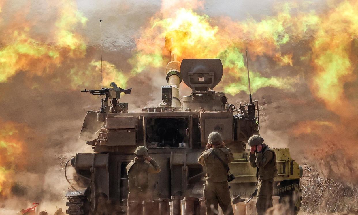 <span>An Israeli self-propelled howitzer firing over the border into Gaza last October.</span><span>Photograph: AFP/Getty Images</span>