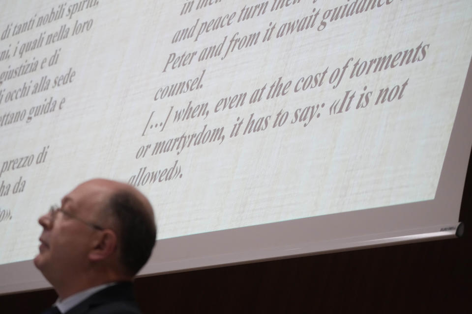 Giovanni Coco, of the Vatican Apostolic Archive, is backdropped by a quote from the Pope Pius XII encyclical Summi Pontificatus, during the international conference "New documents from the Pontificate of Pope Pius XII and their Meaning for Jewish-Christian Relations: A Dialogue Between Historians and Theologians", at the Gregorian University in Rome, Monday, Oct. 9, 2023. (AP Photo/Gregorio Borgia)