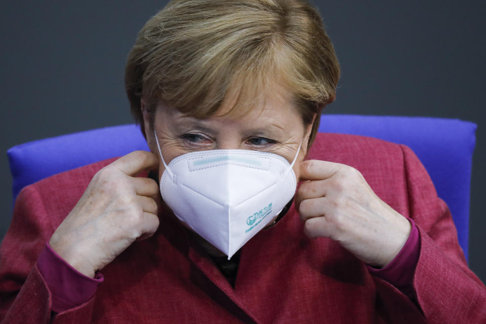 German Chancellor Angela Merkel adjusts her face mask as she arrives for a speech about German government's policies to combat the spread of the coronavirus and COVID-19 disease at the parliament Bundestag, in Berlin, Germany, Thursday, Oct. 29, 2020. (Photo/Markus Schreiber)