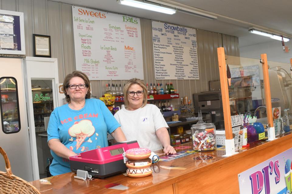 Tavia Ducote (left) owns Sweet and Eats Fun Zone. Her sister-in-law Phyllis Villemarette (right) and her husband Jessie Villemarette own Poppa J’s Donuts. Both businesses operate out of the same building at 931NW Main Street in Bunke.