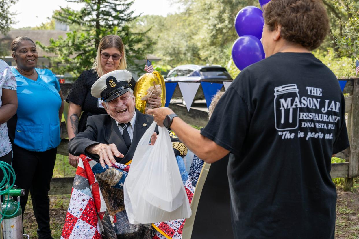 Earlier this year, a woman from The Mason Jar brings John McCrary his favorite meal on this 95th birthday.