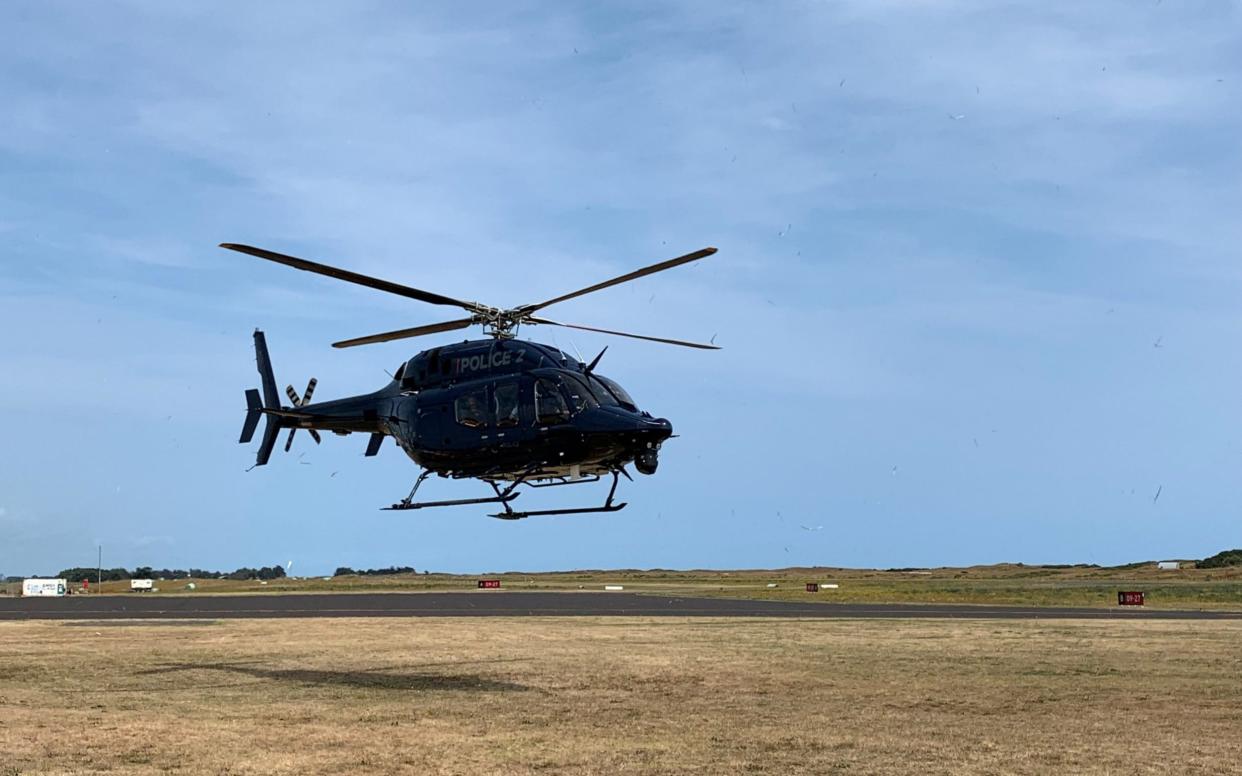 A New Zealand Police helicopter returns to Whakatane Airport after conducting a search for bodies in the aftermath of the eruption of White Island volcano, which is also known by its Maori name Whakaari, December 15, 2019 - via REUTERS