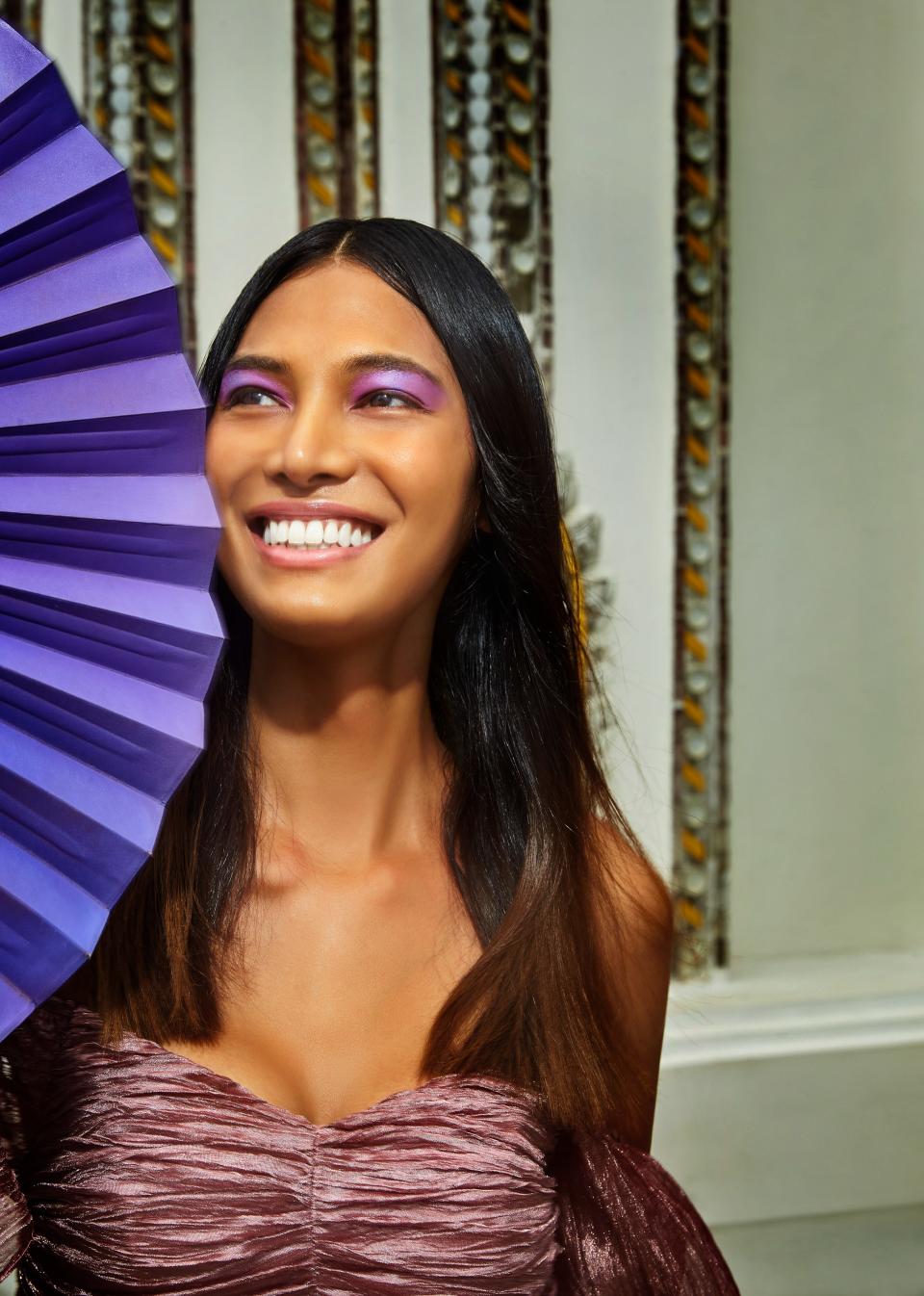 "I used to buy all kinds of whitening skin-care products, but now I realize that this is my skin and I should be more proud of myself. I am perfect," says Kulchaya. Barose created her lotus-inspired shadow using two purples (Make Up For Ever Artist Color Eyeshadows in Lavender and Orchid) to mimic a flower petal. Milin dress.