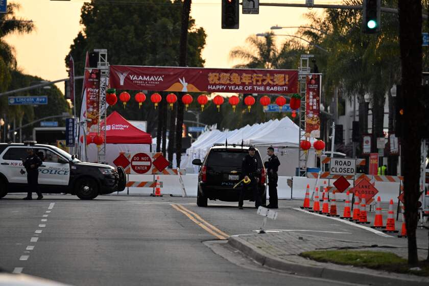 TOPSHOT - Police work near the scene of a mass shooting in Monterey Park, California, on January 22, 2023. - Ten people have died and at least 10 others have been wounded in a mass shooting in a largely Asian city in southern California, police said, with the suspect still at large hours later. (Photo by Robyn BECK / AFP) (Photo by ROBYN BECK/AFP via Getty Images)