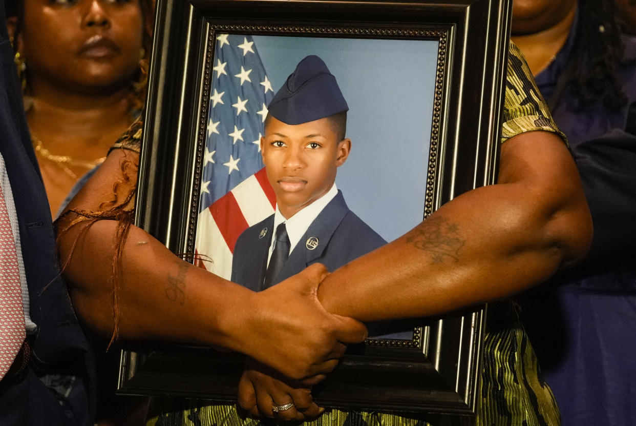 Chantemekki Fortson, mother of Roger Fortson, a U.S. Air Force senior airman, holds a photo of her son during a news conference regarding his death, along with family and attorney Ben Crump, May 9, 2024, in Fort Walton Beach, Florida. / Credit: AP Photo/Gerald Herbert