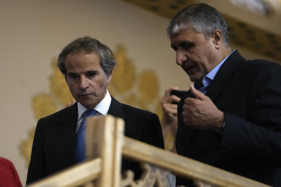 International Atomic Energy Organization, IAEA, Director General Rafael Grossi, left, and head of Iran's atomic energy department Mohammad Eslami arrive for a joint press conference after their meeting in the central city of Isfahan, Iran, Tuesday, May 7, 2024. (AP Photo/Vahid Salemi)