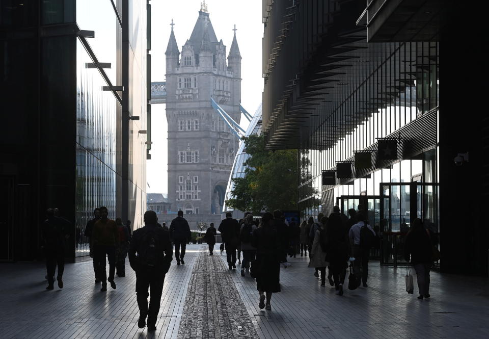 London: Workers walk towards Tower Bridge during the morning rush hour