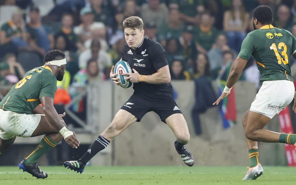 Beauden Barrett takes on the Springboks defence before he had to leave the pitch following the sickening clash - GETTY IMAGES