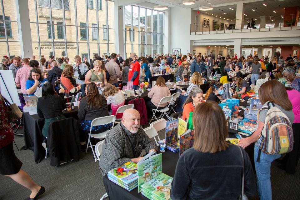 Readers and fans flock to Tim Bowers' table at the 2023 Ohioana Book Festival, the first "live" festival since 2019, which drew a record crowd of 5,100 attendees.