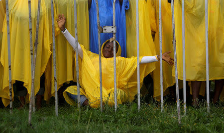 A pilgrim prays before the opening ceremony of World Youth Day in Krakow, Poland, July 26, 2016. REUTERS/David W Cerny