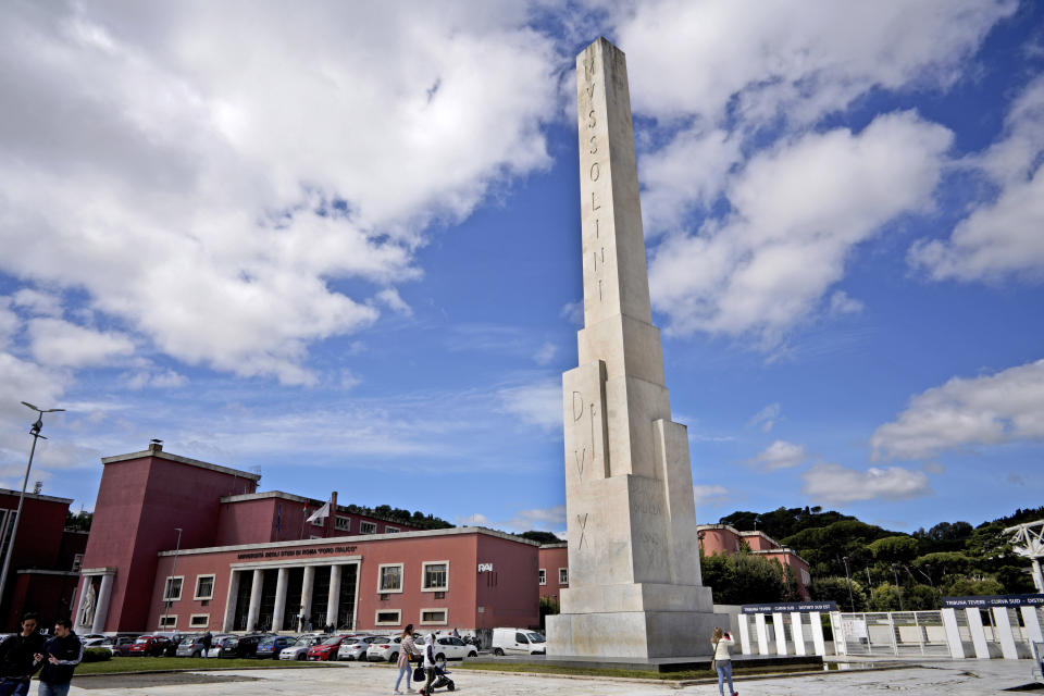 FILE - A marble obelisk by architect Costantino Costantini with engravings reading in Latin Mussolini Dux (Mussolini Leader) stands in front of the Olympic Stadium, in Rome, Monday, May 6, 2019. Italy's failure to come to terms with its fascist past is more evident as it marks the 100th anniversary, Friday, Oct. 28, 2022, of the March on Rome that brought totalitarian dictator Benito Mussolini to power as the first postwar government led by a neo-fascist party takes office. (AP Photo/Andrew Medichini, File)