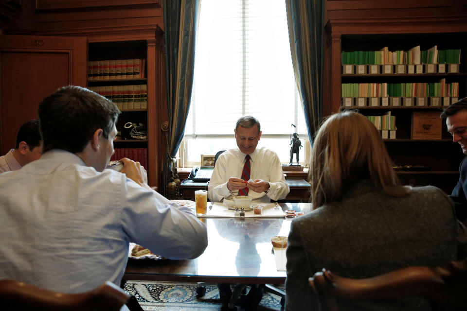 U.S. Chief Justice John Roberts eats a bowl of soup as he sits down to lunch with his team of clerks in his private study at the U.S. Supreme Court in Washington on June 15, 2016.