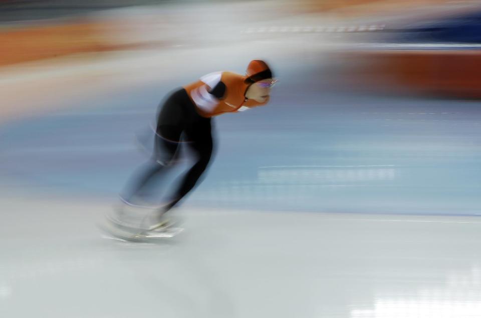 Irene Wust of the Netherlands makes her way around a turn during the women's 3000-meter speedskating competition at the 2014 Winter Olympics, Sunday, Feb. 9, 2014, in Sochi, Russia. Wust went on to win the gold medal. (AP Photo/Morry Gash)