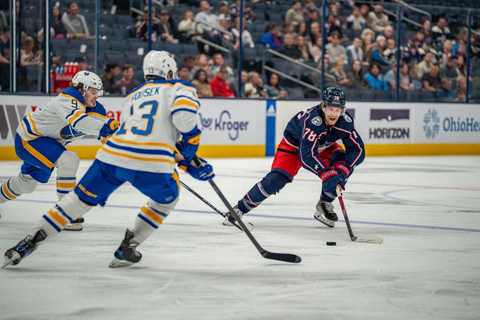 Oct 4, 2023; Columbus, Ohio, United States;
Columbus Blue Jackets defenseman Damon Severson (78) races towards the puck against Buffalo Sabres right wing Lukas Rousek (13) and forward Zach Benson (9) during their game on Wednesday, Oct. 4, 2023 at Nationwide Arena.