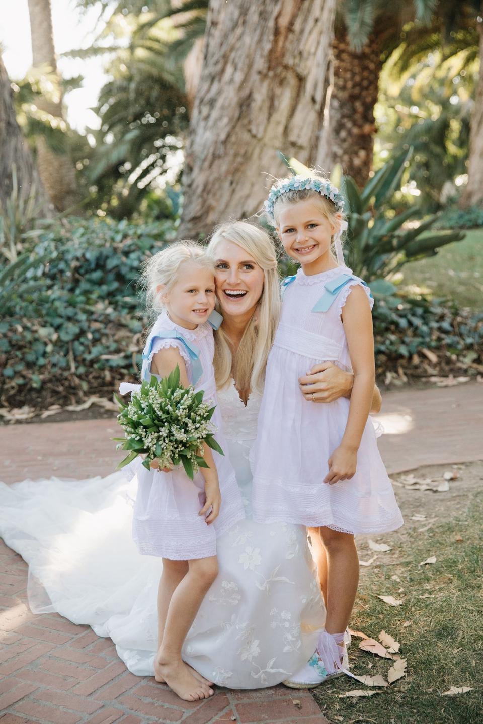 The bride combined California cool with English tradition, wore two Carolina Herrera dresses, and drove off in a vintage Porsche.