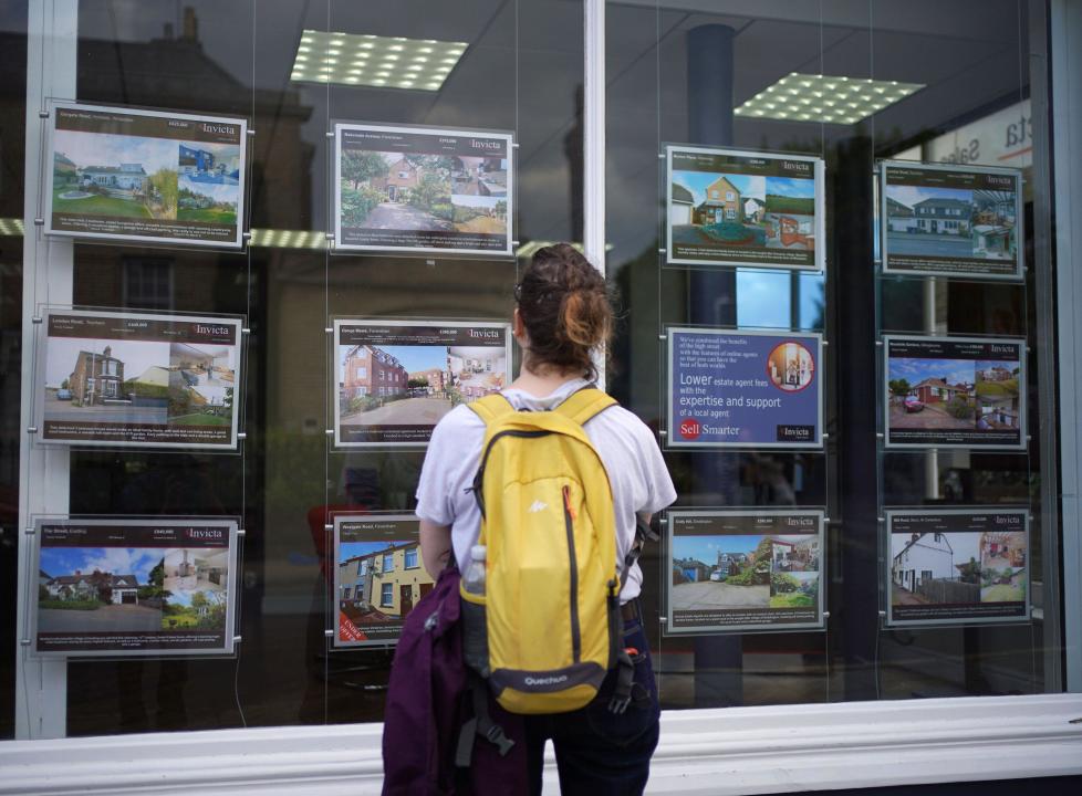 File photo dated 20/07/23 of a woman looking at advertisements in an estate agents window. The number of mortgage approvals made to home buyers increased from 56,100 in January to 60,400 in February, according to Bank of England figures. Approvals for remortgaging also increased, from 30,900 to 37,700 during this period, according to the Money and Credit report. The annual growth rate for consumer credit slowed from 9.0% to 8.7%. Issue date: Tuesday April 2, 2024.