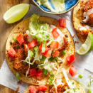 <p>These air-fryer fish tacos get their kick from a crispy breadcrumb coating that's spiked with chili powder. Avocado crema helps balance the flavors, while shredded cabbage slaw adds crunch. These easy air-fryer fish tacos are finished with fresh tomato, but feel free to add your own favorite toppings to the mix. <a href="https://www.eatingwell.com/recipe/7962551/air-fryer-fish-tacos/" rel="nofollow noopener" target="_blank" data-ylk="slk:View Recipe;elm:context_link;itc:0" class="link ">View Recipe</a></p>