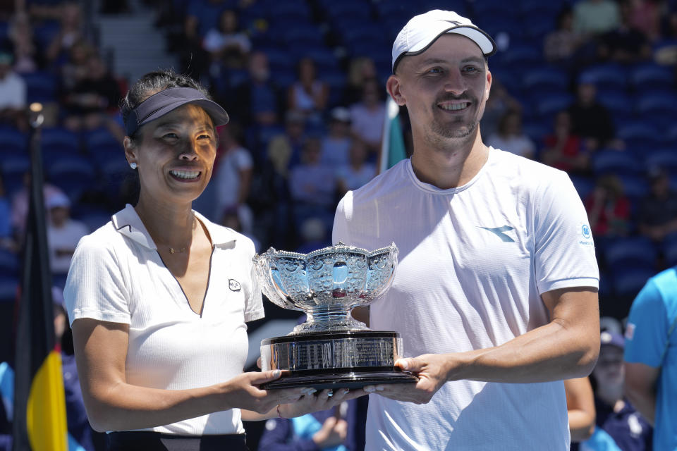 Hsieh Su-Wei, left, of Taiwan and Jan Zielinski of Poland hold their trophy after defeating Desirae Krawczyk of the U.S. and Neal Skupski of Britain in the mixed doubles final match at the Australian Open tennis championships at Melbourne Park, Melbourne, Australia, Friday, Jan. 26, 2024. (AP Photo/Andy Wong)