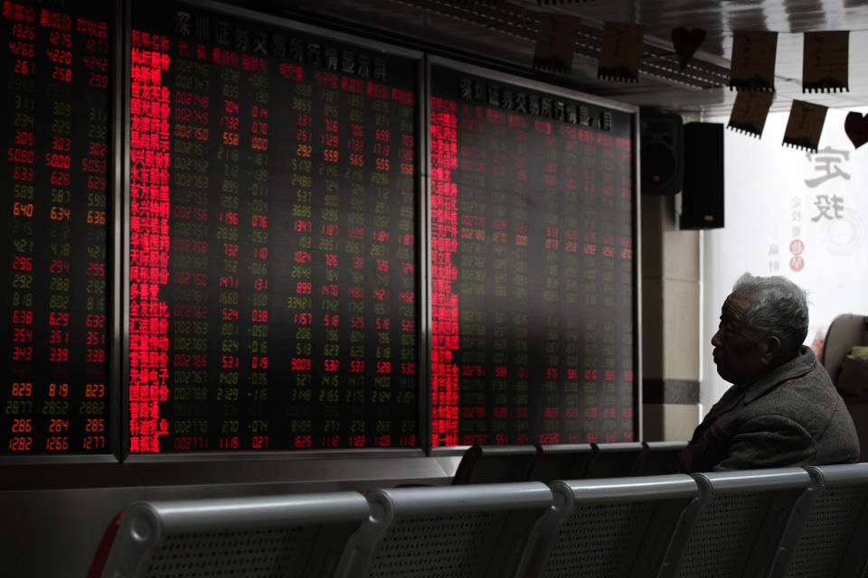 An investor monitors stock prices at a brokerage house in Beijing, Thursday, Jan. 3, 2019. Asian markets were mostly higher Thursday after tumbling more than 1 percent on the first trading day of 2019, as weaker-than-expected Chinese data exacerbated growth fears. (AP Photo/Andy Wong)