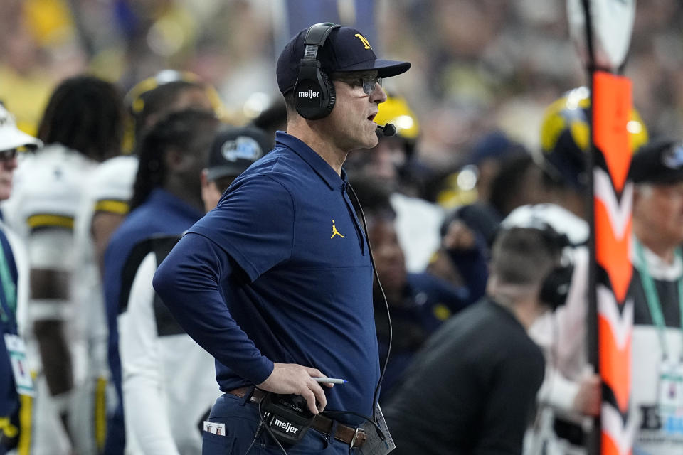 Michigan head coach Jim Harbaugh watches from the sideline during the first half of the Big Ten championship NCAA college football game against Iowa, Saturday, Dec. 2, 2023, in Indianapolis. (AP Photo/Darron Cummings)