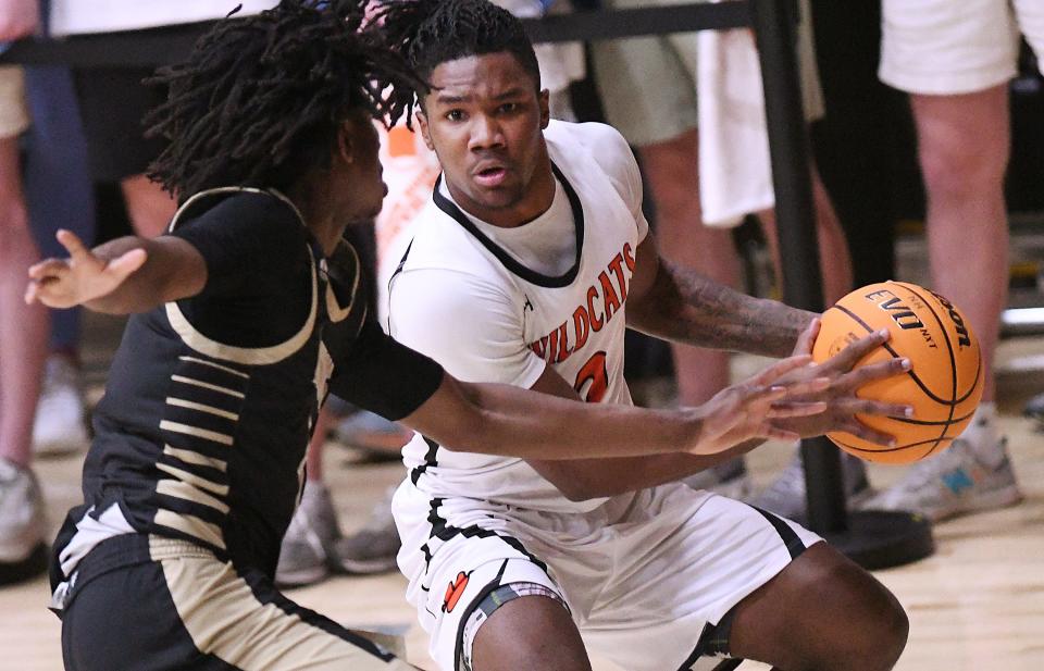 New Hanover's #2 Zeus Batts looks to pass off the ball inside as New Hanover took on Knightdale in the 2nd round of the playoffs Friday March 1, 2024 at Brogden Hall in Wilmington, N.C. KEN BLEVINS/STARNEWS