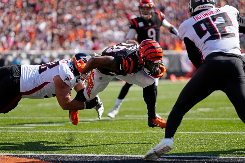 Cincinnati Bengals running back Joe Mixon (28) makes a carry for a touchdown in the first quarter of the NFL Week 7 game between the Cincinnati Bengals and the Atlanta Falcons at Paycor Stadium in downtown Cincinnati on Sunday, Oct. 23, 2022. The Bengals led 28-17 at halftime. 


Mandatory Credit: Sam Greene-The Enquirer