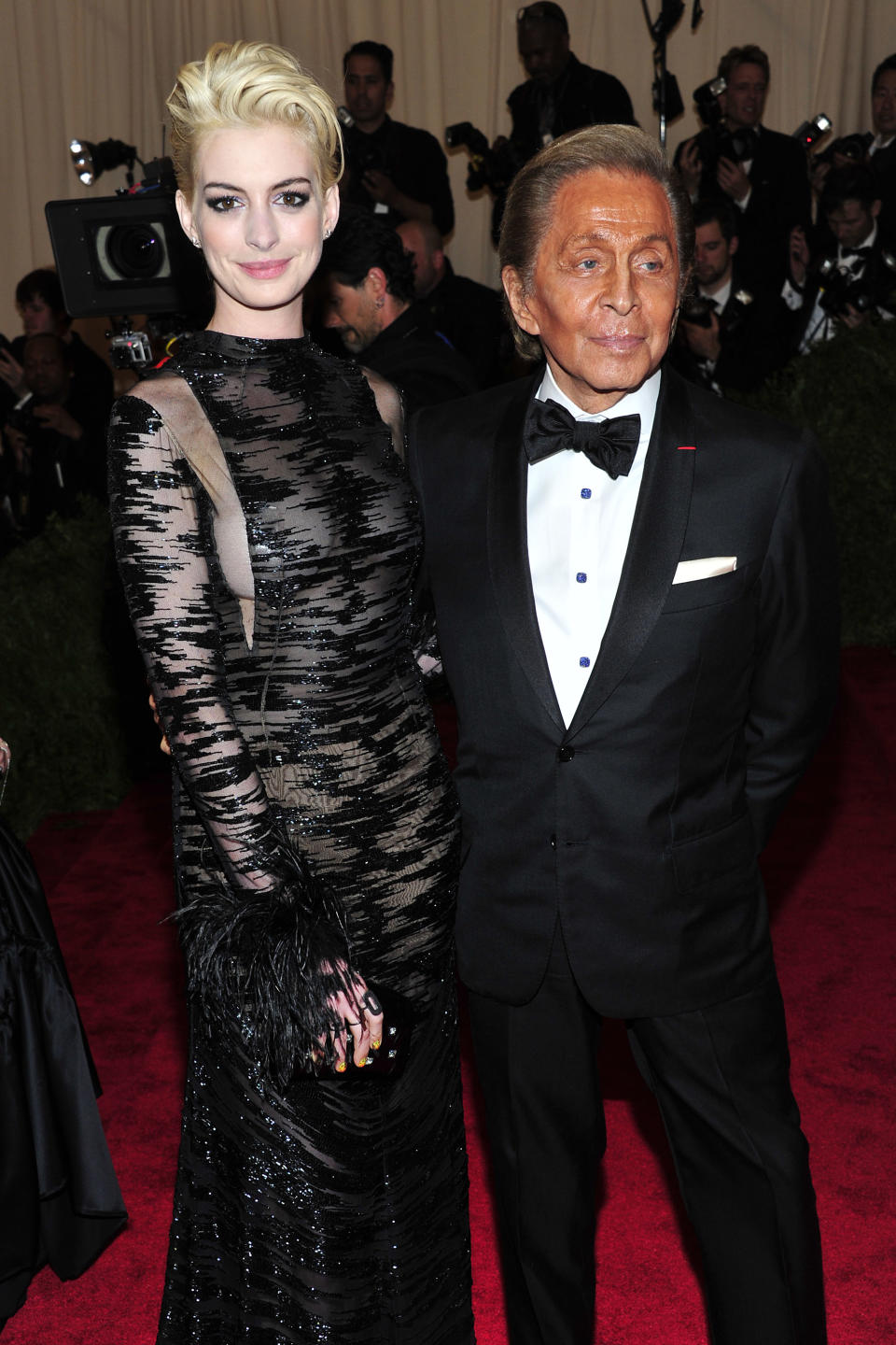Anne Hathaway, left, and Valentino Garavani attends The Metropolitan Museum of Art's Costume Institute benefit celebrating "PUNK: Chaos to Couture" on Monday May 6, 2013 in New York. (Photo by Charles Sykes/Invision/AP)