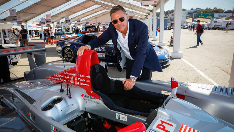 Tom Kristensen, nine-time winner of Le Mans, next to the 2005 Audi R8 LMP1 he drove to victory. - Credit: Stephan Cooper, courtesy of Rolex.