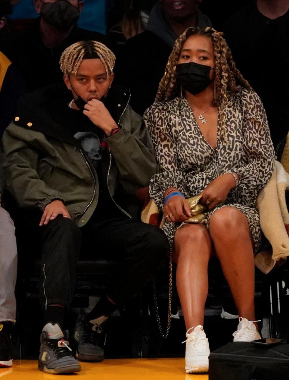 Naomi Osaka with boyfriend and rapper Cordae at Los Angeles Lakers game on Dec. 21, 2021. - Credit: London Entertainment / SplashNews.com