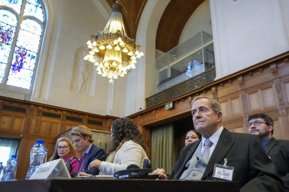 Nicaragua's agent Carlos Jose Arguello Gomez and his delegation wait for judges to enter the World Court in The Hague, Netherlands, Thursday, July 13, 2023, where the United Nations' highest court delivers its judgment in a long-running maritime border dispute between Nicaragua and Colombia. (AP Photo/Peter Dejong)