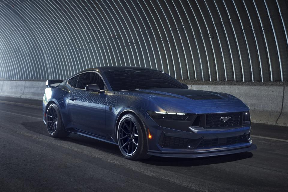 This photo provided by Ford shows the 2024 Mustang Dark Horse. Fitted with a 500-horsepower V8, the Dark Horse is the most powerful Mustang for 2024. (Courtesy of Ford Motor Co. via AP)