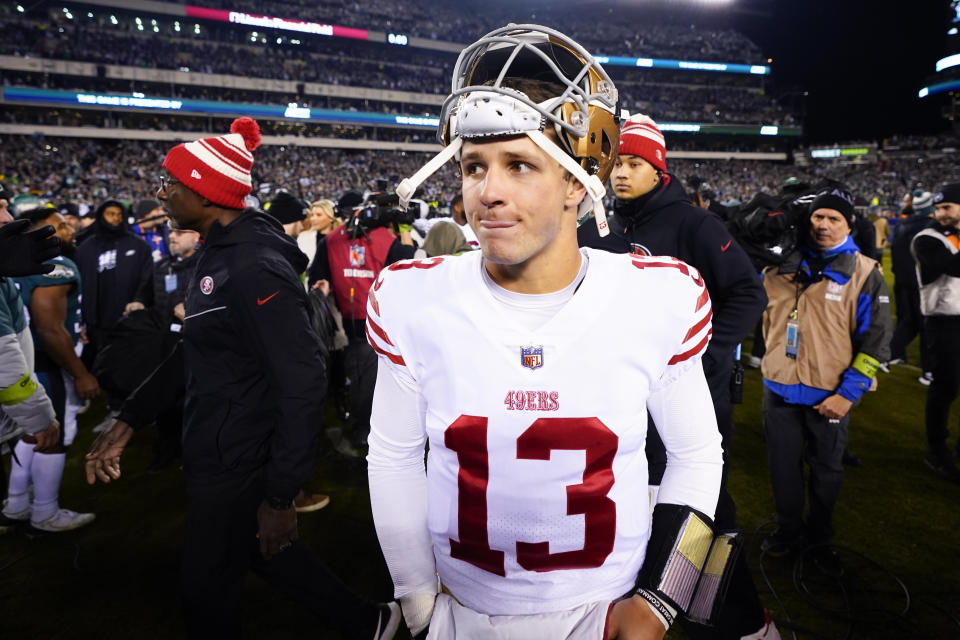 FILE - San Francisco 49ers quarterback Brock Purdy walks on the field after the NFC Championship NFL football game between the Philadelphia Eagles and the San Francisco 49ers on Sunday, Jan. 29, 2023, in Philadelphia. The Eagles won 31-7. NFL teams will be allowed to play an emergency quarterback from the inactive list if the first two are injured during a game, a rule change approved by league owners on Monday, May 22, 2023, that stemmed from San Francisco's depth-chart challenge in the NFC championship game. (AP Photo/Chris Szagola, File)