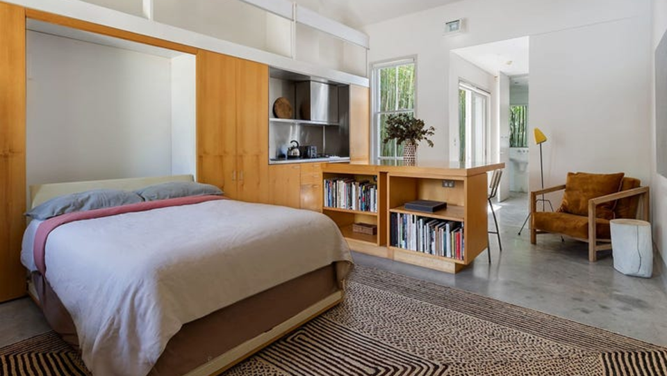 A fold down bed in the living space of a studio in Paddington.