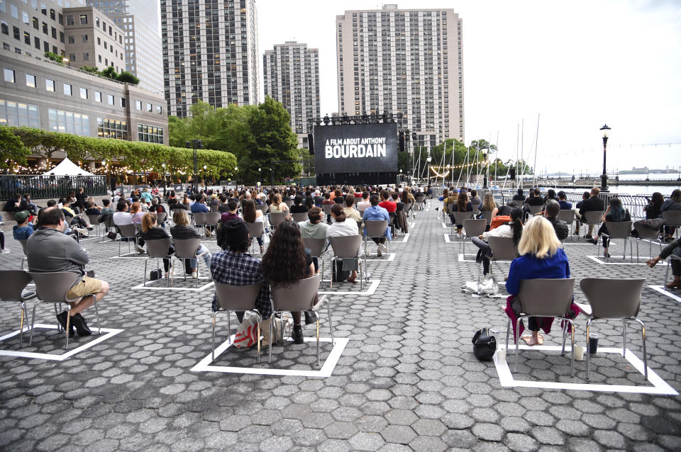 Filmgoers watch the premiere of "Roadrunner: A Film About Anthony Bourdain" during the 20th Tribeca Festival at Brookfield Place on Friday, June 11, 2021, in New York. (Photo by Evan Agostini/Invision/AP)