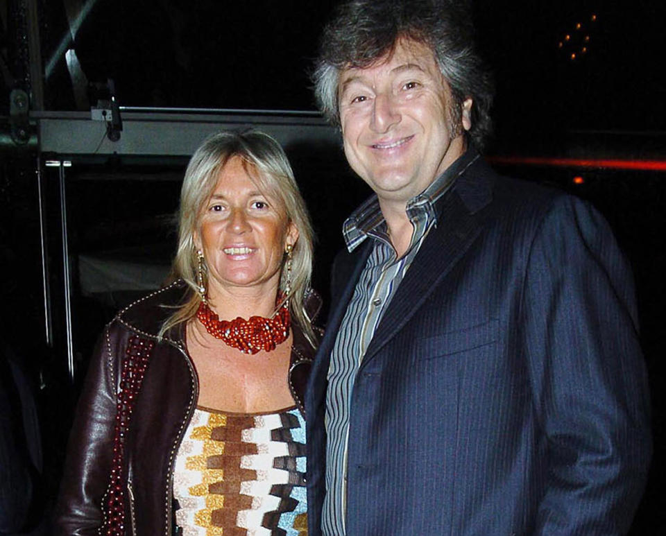 FILE - In this March 30, 2005 file photo, Vittorio Missoni, right, and his wife Maurizia Castiglioni pose for a photo in Milan, Italy. The underwater wreckage of a plane that disappeared off Venezuela on Jan. 4, 2013 with Missoni, the CEO of Italy's iconic Missoni fashion house, and five other people on board has been found, government officials and family members said Thursday, June 27, 2013. Flying with Missoni on the flight from Venezuela's Los Roques resort archipelago to Caracas, was his wife Maurizia Castiglioni, two Italian friends of the couple, and a crew of two Venezuelans. (AP Photo/Livio Valerio, Lapresse, File)