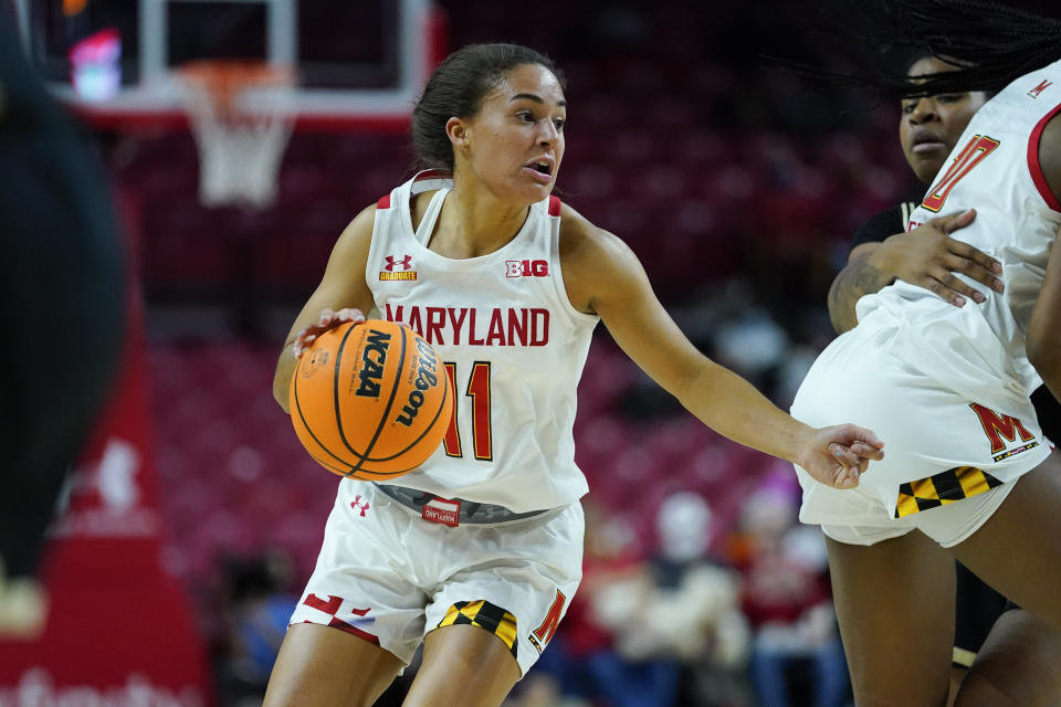 Maryland guard Diamond Miller drives against Purdue during the first half of an NCAA college basketball game, Wednesday, Dec. 8, 2021, in College Park, Md. (AP Photo/Julio Cortez)