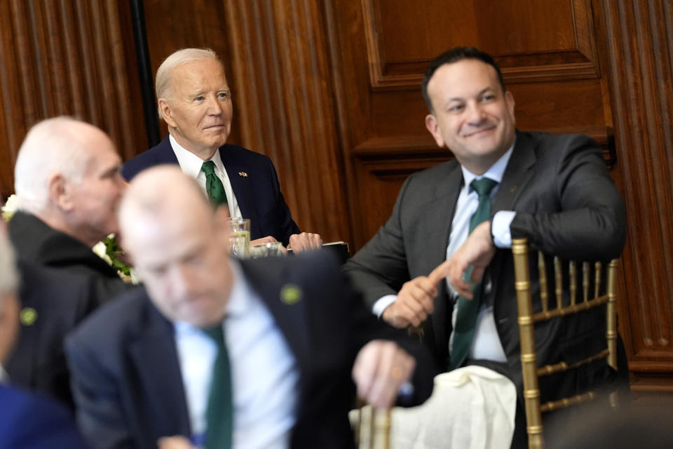 President Joe Biden, left, and Ireland's Taoiseach Leo Varadkar, right, attend a Friends of Ireland luncheon on Capitol Hill, Friday, March 15, 2024, in Washington. (AP Photo/Andrew Harnik)