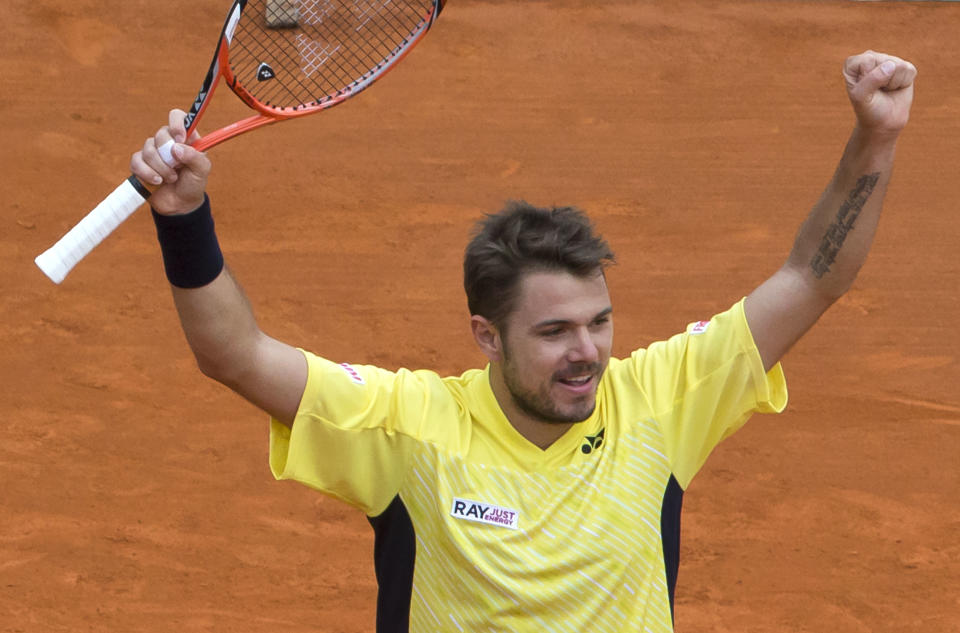 Stanislas Wawrinka of Switzerland, celebrates as he defeated David Ferrer of Spain during their semifinal match of the Monte Carlo Tennis Masters tournament in Monaco, Saturday, April 19, 2014. Wawrinka won 6-1 7-6. (AP Photo/Michel Euler)