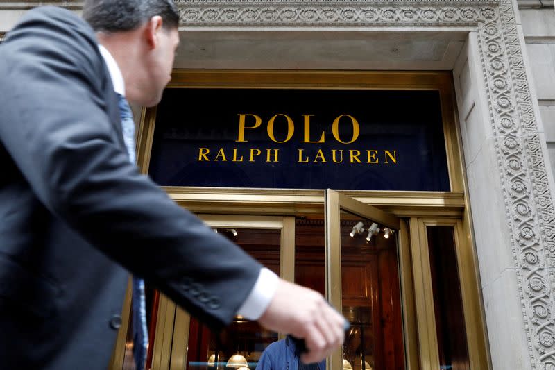 FILE PHOTO: A man walks past Ralph Lauren Corp.'s flagship Polo store on Fifth Avenue in New York