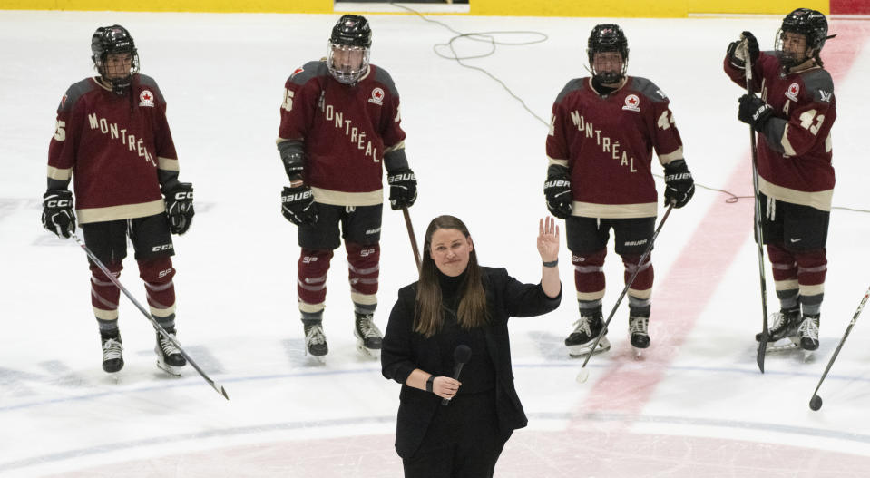 Montreal coach Kori Cheverie wavdes to the crowd following the team's PWHL hockey game against New York in a PWHL hockey game Wednesday, April 24, 2024, in Montreal. (Christinne Muschi/The Canadian Press via AP)