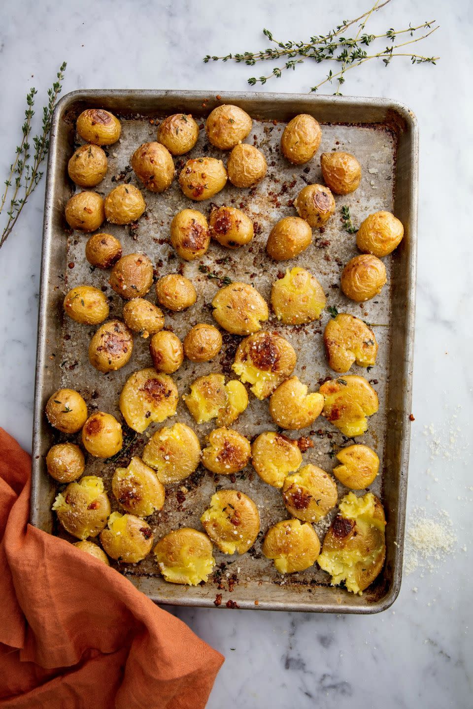 <p>Parm and butter take taters to a whole new level.</p><p>Get the recipe from <a href="https://www.delish.com/cooking/recipe-ideas/recipes/a49007/garlic-smashed-potatoes-recipe/" rel="nofollow noopener" target="_blank" data-ylk="slk:Delish;elm:context_link;itc:0;sec:content-canvas" class="link ">Delish</a>.</p>