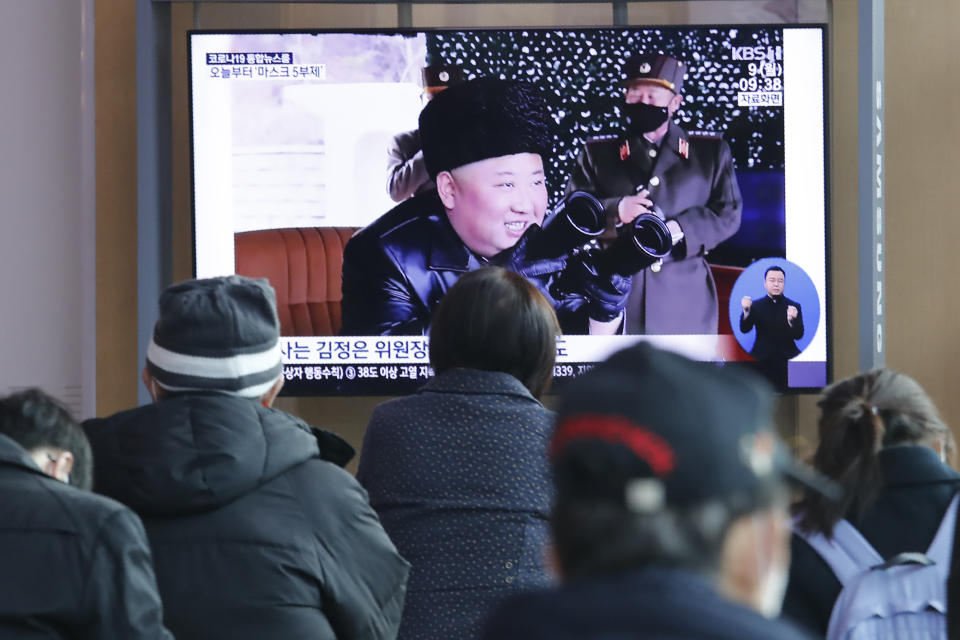 People watch a TV showing a file image of North Korean leader Kim Jong Un during a news program at the Seoul Railway Station in Seoul, South Korea, Monday, March 9, 2020. North Korea fired three unidentified projectiles off its east coast on Monday, South Korea's military said, two days after the North threatened to take "momentous" action to protest outside condemnation over its earlier live-fire exercises. (AP Photo/Ahn Young-joon)