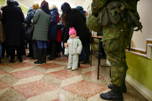 Security was tight with gun-toting, camouflage-clad guards deployed to ensure order