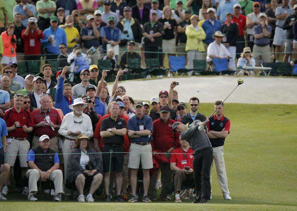 Rory McIlroy of Northern Ireland hits a driver off the third tee during his practice round ahead of the 2015 Masters at the Augusta National Golf Course in Augusta, Georgia April 6, 2015. REUTERS/Brian Snyder