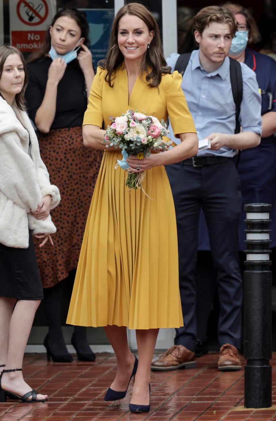 Catherine, Princess of Wales smiles as she departs the maternity unit after a visit to the Royal Surrey County Hospital