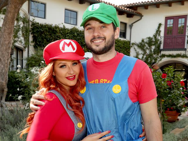 <p>Christopher Polk/Getty</p> Christina Aguilera and Matthew Rutler during their daughter Summer Rain Rutler's second birthday party in August 2016.