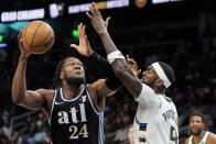 Atlanta Hawks forward Bruno Fernando (24) drives against Milwaukee Bucks forward Bobby Portis (9) during the first half of an NBA basketball game, Saturday, March 30, 2024, in Atlanta. (AP Photo/Mike Stewart)