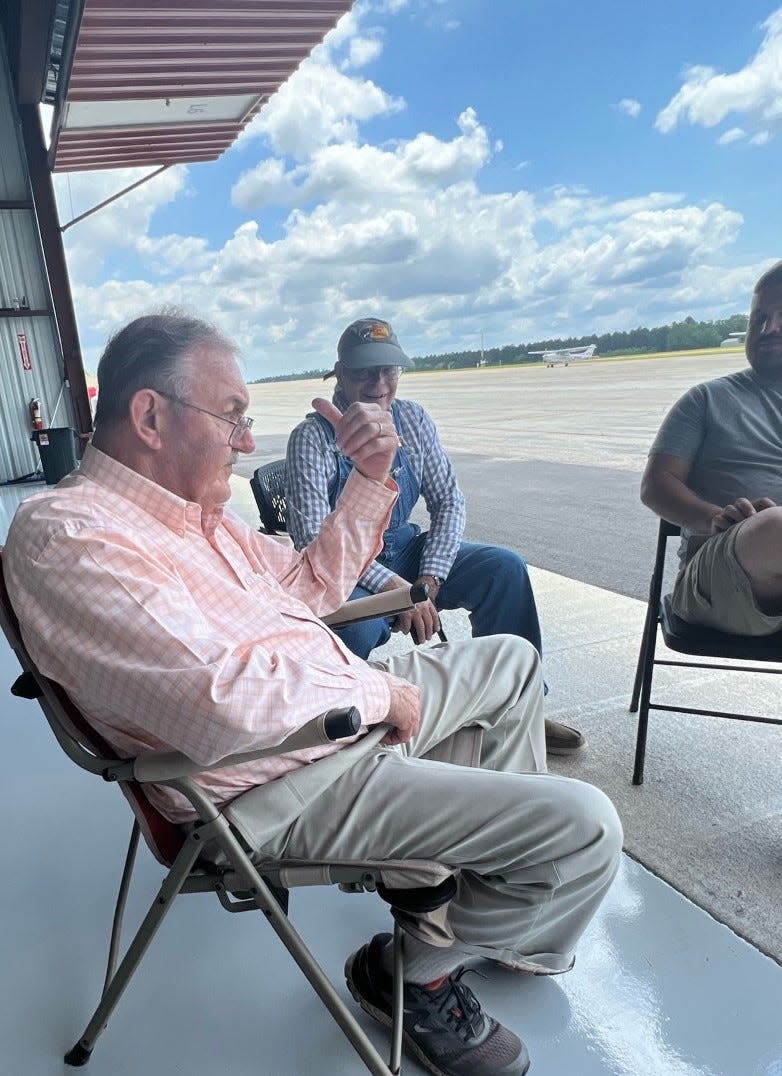 Retired crop duster Pierre Smith of Louisville was among those who gathered at the city's new hangars for the event.