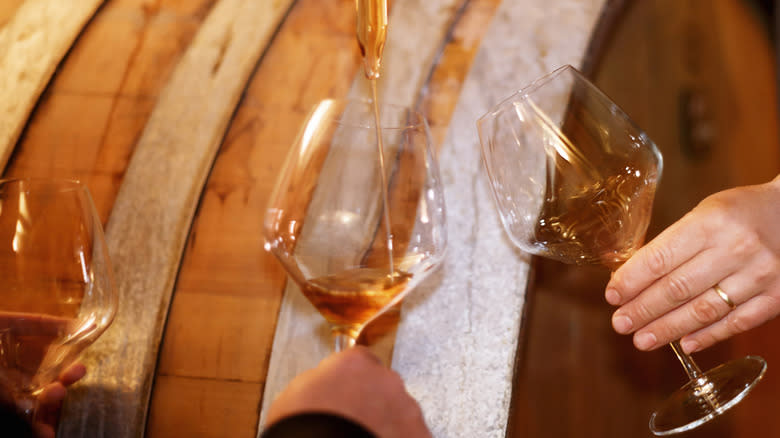Whiskey poured into wine glasses