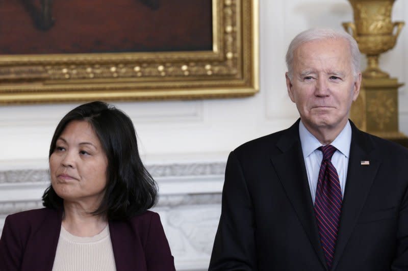 U.S. President Joe Biden stands with acting Secretary of Labor Julie Su during an event focused on retirement security and junk fees in the State Dining Room of the White House in Washington, D.C., on Tuesday. Photo by Yuri Gripas/UPI